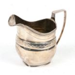 A George III silver cream jug of helmet form, London 1805, weight 128g, 10cms (4ins) high.