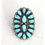 A Native American Navajo turquoise and silver panel ring by Justin Wilson, impressed Sterling JMW.