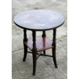 A Victorian mahogany circular two-tier occasional table with copper top, 56cms (22ins) diameter.