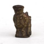 A bronze novelty advertising golf figure, 6cms (2.25ins) high.