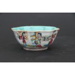 A Chinese famille rose bowl decorated with figures, red seal mark to the underside, 15cms (6ins)