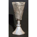 An Ottoman silver plated chalice decorated with foliate scrolls, 16cms (6.25ins) high.