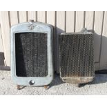 An Austin 7 chrome radiator surround and radiator.