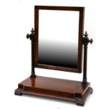 A Victorian mahogany toilet mirror, 56cms (22ins) wide; together with another similar, 37.5cms (14.