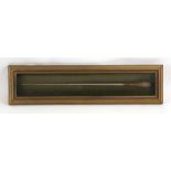 A turned wooden conductor's baton mounted in a box frame, 42cms (16.5ins) long.