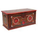 A continental painted box of small proportions, with carved decoration, 58cms (23ins) wide.