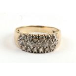 A 9ct gold ring set with three rows of clear stones, approx UK size 'K'