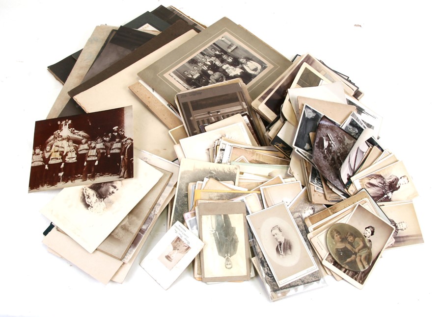 A quantity of assorted monochrome Edwardian and later photographs, the majority portraits.