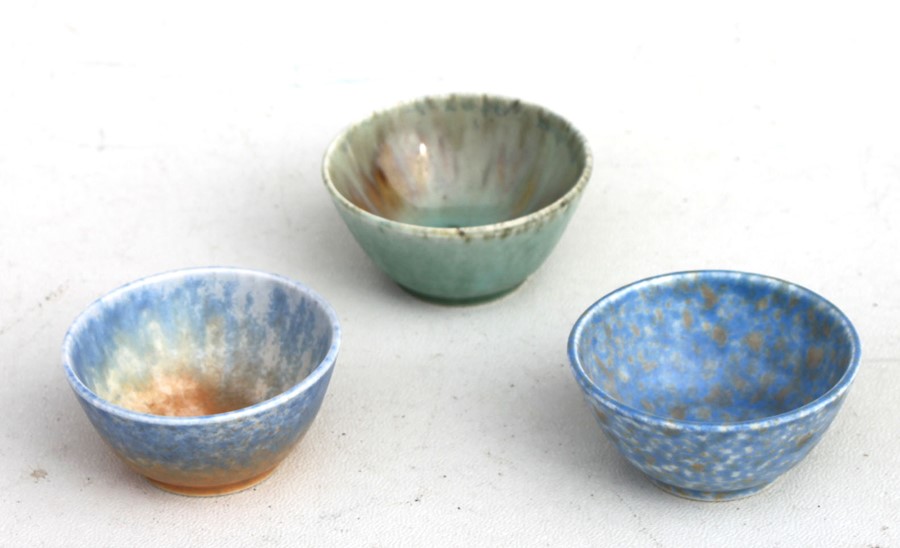 Three Ruskin pottery miniature bowls, each with an impressed mark to the underside, 6cms (2.25ins)