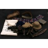 An Asian pith style helmet; together with two silk embroidered belts, a 19th century brass grater