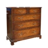 A burr walnut chest of two short and three long graduated drawers, on bracket feet, 102cms (40ins)