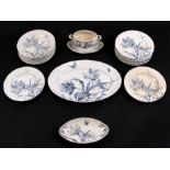 A French blue & white part dinner service decorated with flowers and butterflies.