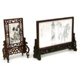 An early 20th century Chinese hardwood and ivory table screen, the rectangular panel decorated