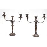 A pair of silver plated three-arm candelabra, 49cms (19.25ins) high.Condition ReportBoth dirty and