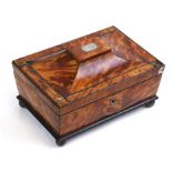 A 19th century tortoiseshell playing card box, of sarcophagus form on bun feet, 19cms (7.5ins)