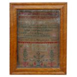 A 19th century sampler, with alphabet verse and flowers, dated 1849, in a maple frame, 22 by