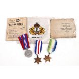 A WW2 Royal Navy medal trio including the Atlantic Star together with his post war Ration Books