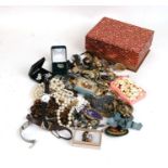 A quantity of costume jewellery and watches.