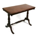 A Victorian mahogany centre table on turned supports joined by a stretcher, 93cms (36.5ins) wide.