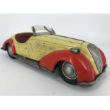 A 1950 Distler BMW Wanderer clockwork tin plate car, manufactured in the US zone of West Germany,