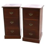 A pair of mahogany chests, each with three deep short drawers, on a plinth base, 51cms (20ins)