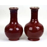 Two Chinese sang de boeuf vases of baluster form, 23cms (9ins) high.Condition ReportDamage and glued