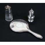 A silver pepper pot, London 1766; together with a silver topped sugar shaker and a silver hand