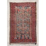 An early 20th century Persian Balouch rug with repeated geometric design, 159 by 94cms (63.5 by