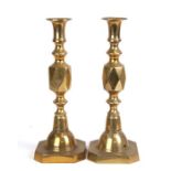 A pair of Victorian style brass diamond candlesticks, 30cms (12ins) high.
