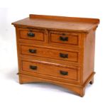 An Edwardian painted pine chest of drawers with two short and two long drawers, 92cms (36ins) wide.