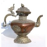 A large Tibetan brass and copper teapot with dragon handle and stylised elephant spout, 44cms (17.