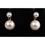 A pair of 9ct gold pearl drop stud earrings.Condition ReportLarger pearls are 7mm diameter