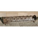 A cast iron feeder / planter, 125cms (49ins) wide.