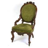 A Victorian carved walnut occasional chair with upholstered seat and back.Condition ReportGood