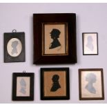 A silhouette portrait miniature in a rosewood frame; together with five other silhouette