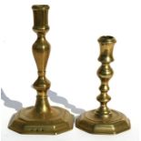 Two early English 18th century brass candlesticks, the largest 21cms (8.25ins) (2).