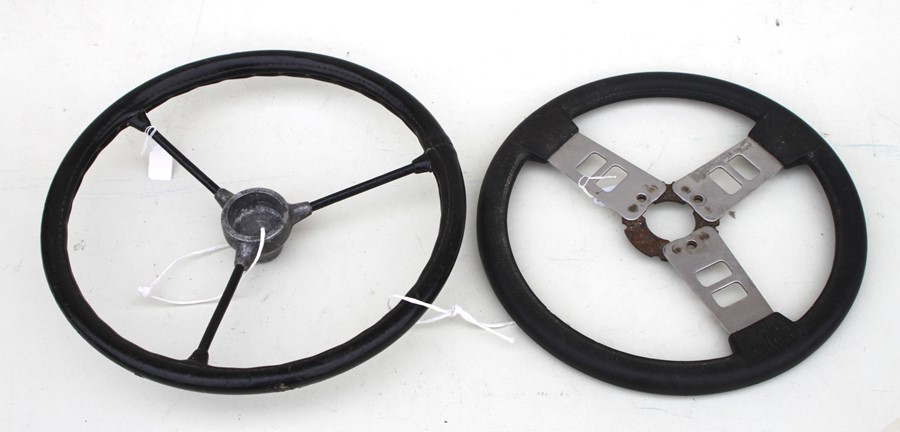 A 1960's / 70'2 aluminium three-spoke steering wheel, 36cms (14ins) diameter; together with a