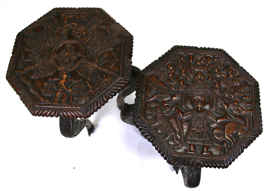 A pair of African Yoruba carved wooden side tables decorated with elephants, figures and palm trees, - Image 2 of 2