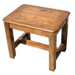 A pitch pine occasional table with rectangular top, on square legs joined by an 'H' stretcher with