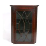 A astragal glazed mahogany corner cupboard.