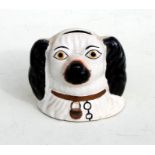 A Staffordshire style spaniel head money box, 10cms (4ins) high.