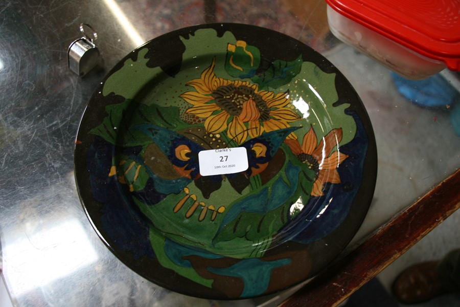 A Gouda pottery plate decorated with a butterfly and sunflowers; together with a similar shallow - Image 2 of 6