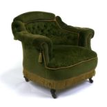 An Edwardian button backed upholstered tub chair on turned front supports.Condition ReportFrame
