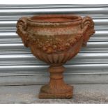 A terracotta urn of classical form, 48cms (19ins) high.Condition ReportRepaired corner to base