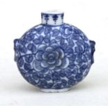 A Chinese blue & white snuff bottle decorated with flowers and foliage, four character blue mark
