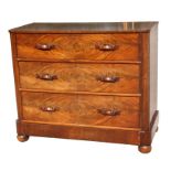 A Victorian mahogany chest of three long drawers, on a plinth base, 115cms (45ins) wide.