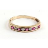 A 9ct gold ruby and diamond half eternity ring, approx UK size 'R'.