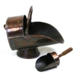 A 19th century copper coal scuttle with fitted shovel.