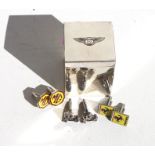 Three pairs of motoring related cufflinks, comprising Ferrari, MG and veteran cars, and a chrome