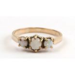 A 9ct gold three-stone opal ring, approx UK size 'S'.Condition ReportSetting dirty, no cracks to the